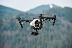 Drone with UAS Insurance Flying in the sky near mountains
